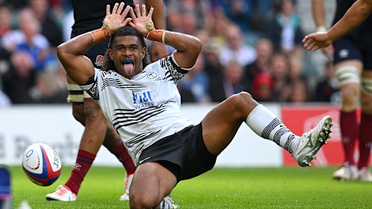 Simione Kuruvolia of Fiji celebrates scoring the team’s third try.