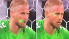 A laser pointer shines in Kasper Schmeichel’s face as England takes a penalty in the Euro 2020 match on Wednesday.