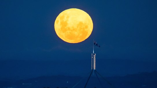 A ‘supermoon’ rises over Canberra with Parliament House in the foreground, on Tuesday 27 April 2021. fedpol Photo: Alex Ellinghausen