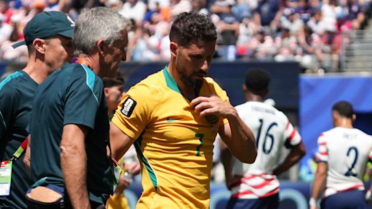 Mathew Leckie walks off the pitch after injuring his hamstring.