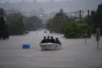 Residents try to evacuate the areas around Lismore as the flood begins to rise on Monday morning.