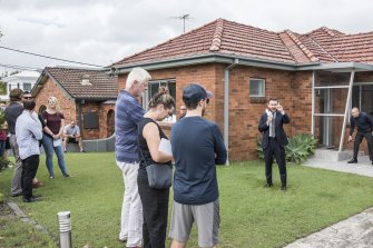 A house auction in Sydney this month. The total value of the nation’s homes rose $2 trillion last year.