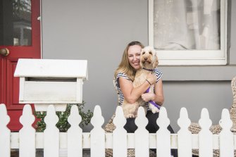 Yvette Peverell and her spoodle Libby outside their Balmain home.