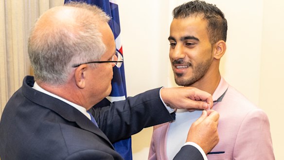 Hakeem Al-Araibi (right) with Prime Minister Scott Morrison at the citizenship ceremony. 