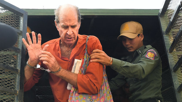 Ricketson, who was accused of espionage, exits the prison van as he arrives at the Phnom Penh Municipal Court  for a court appearance.