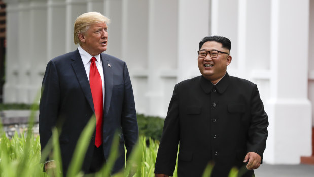Donald Trump and Kim Jong-un walking together after lunch.