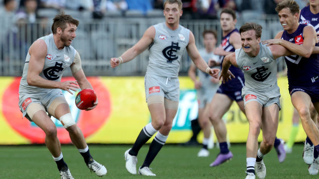 Sharp start: Dale Thomas loos for a way forward after Carlton took an early lead against Fremantle at Optus Stadium in Perth.