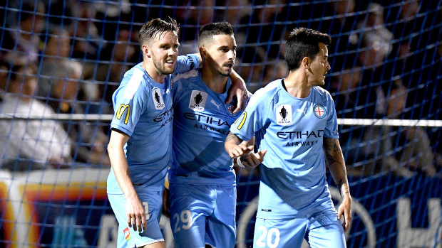 Jamie Maclaren is congratulated after one of his two goals which helped Melbourne City into the FFA Cup final.