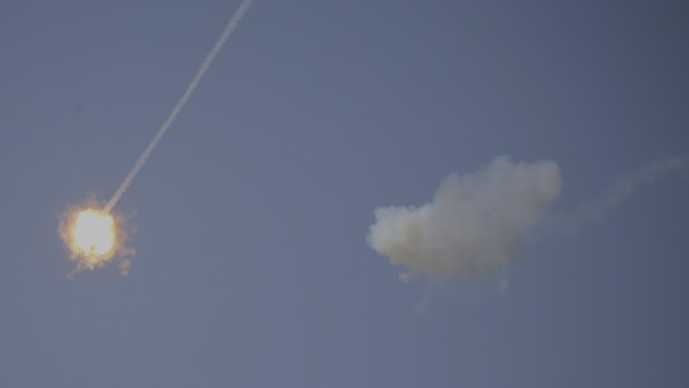 An Israeli Iron Dome air defence system missile intercepts rockets fired from Gaza over Sderot, southern Israel, on Wednesday.