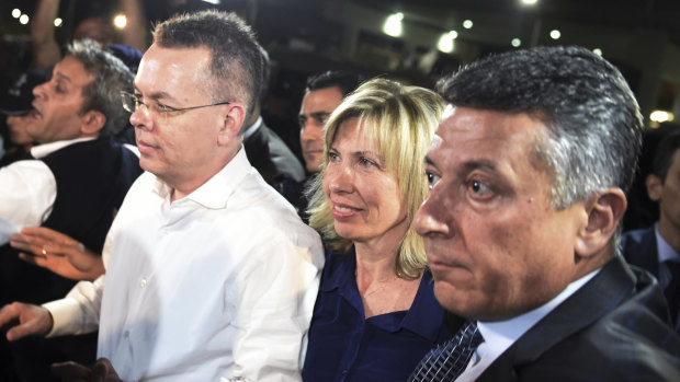 Pastor Andrew Brunson, left, and his wife Norine Brunson arrive at Adnan Menderes airport for a flight to Germany after his release following his trial in Izmir, Turkey.