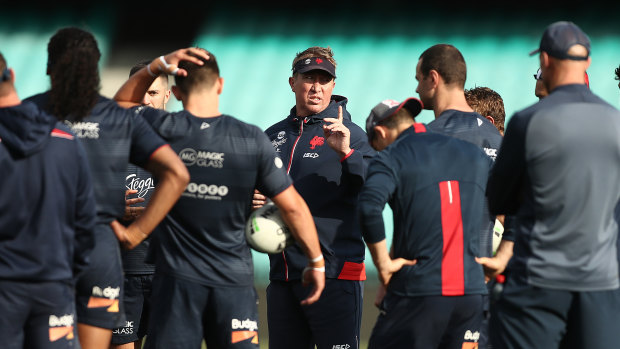 Roosters coach Trent Robinson lays down the law to his players during the week.