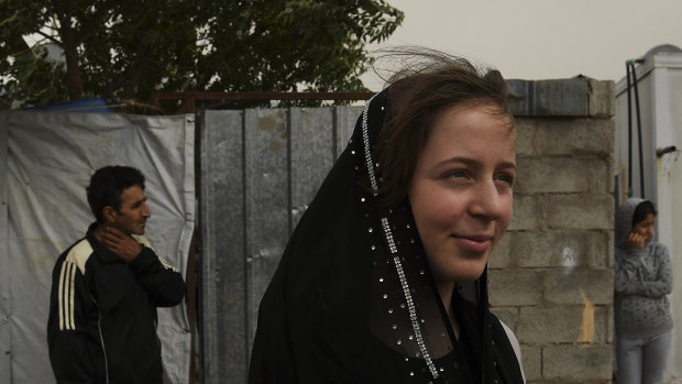 Syrian refugee Nermin Alwan in front of her home in Basirma camp where she lives with her four sisters, brother and parents.