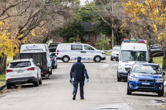 Police at the scene in Epping on Saturday after a man’s body was found and a woman was arrested.