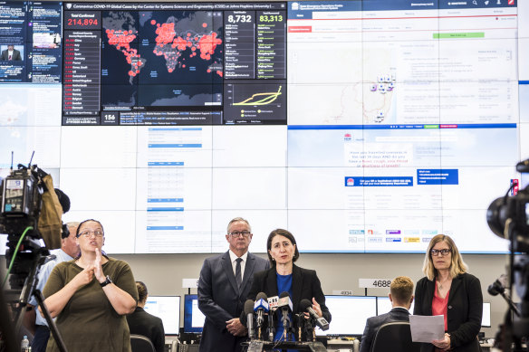 Premier Gladys Berejiklian, Minister for Health Brad Hazzard, NSW Chief Health Officer Kerry Chant at the State Emergency Operations Centre at Sydney Olympic Park.