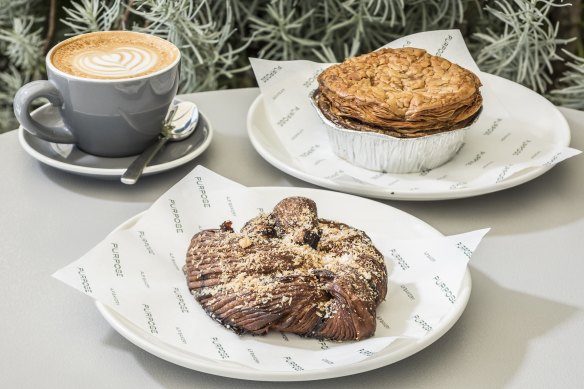 Espresso and gianduja babka croissant and pastrami pie (right) at A.P House cafe in Surry Hills.