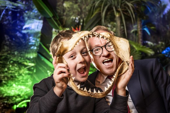 Minister for the Arts Ben Franklin (right) with Hunter Engelhardt, holding the jaws of a white shark.