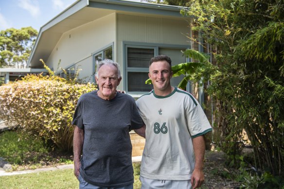 Young Waratah Jack Bowen with grandfather Tony Roche.