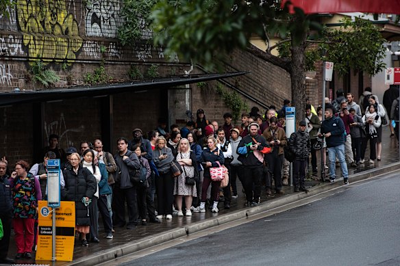 Commuters waiting at Ashfield for train replacement buses to Lidcombe Station.