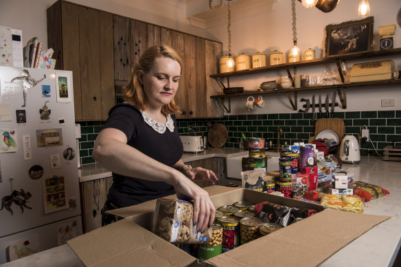 Melissa Paisley and her boyfriend have stocked up on food for themselves and their three cats.