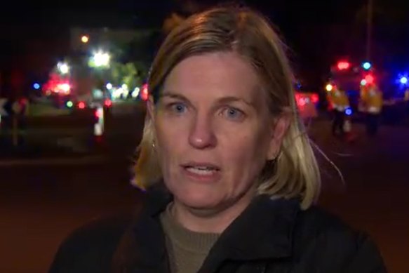 A screenshot of Nicole Kirk, the mother of a grade 5 girl who was on the bus when it crashed, speaking to a Nine News reporter at the scene.