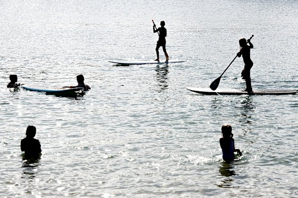Beachgoers enjoy Wollongong Harbour on a warm day on April 8.