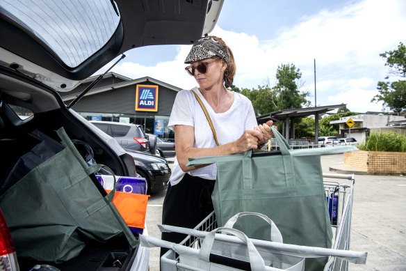 Claire Shepherd packs her car with groceries bought from Aldi at Canterbury.