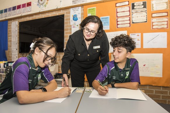 Minchinbury Public School principal Rebecca Webster with students Nevaeh Kake and James Aoun.
