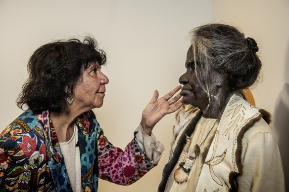 Aunty Irene Ridgeway with the newly clad version of the statue of her great grandmother Nanny Nellie, Nellie Bungil Walker, at the Australian Museum.