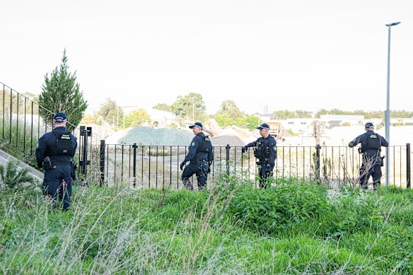 Police search for clues near the scene of a deadly alleged shooting in western Sydney on Monday morning.