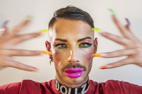 Drag performer Mitchell Doll models Jessica Aitchison’s bright artistry ahead of the parade.