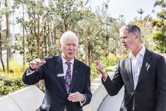 Transport for NSW coordinator-general Howard Collins (left) says the freeway upgrade is one of the biggest in Australia. He’s with Roads Minister John Graham.