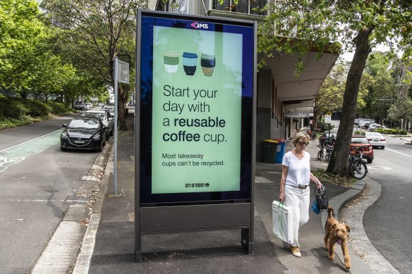 Start your day with advertising: a billboard in the middle of the footpath on Bayswater Road in Kings Cross.