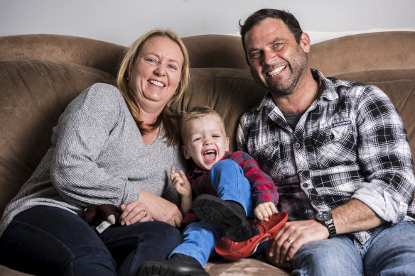 Felicity and Adam Moreau with their adopted son, Christian.