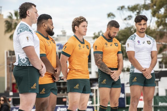 Wallabies players model the gold and white jerseys for the World Cup.