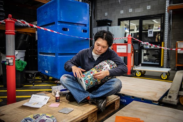 Casey Chen finishes his Wynne Prize entry.