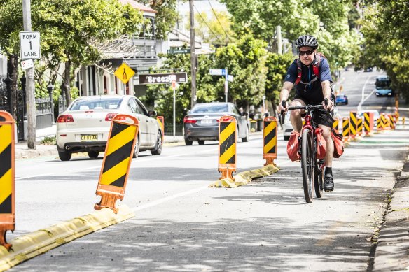 The temporary cycleway on Bridge Road, Glebe, which the state government has committed to making permanent.