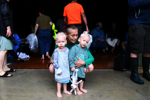 Gabby Thatcher with her sons Elijah and Lachlan in the evacuation centre.