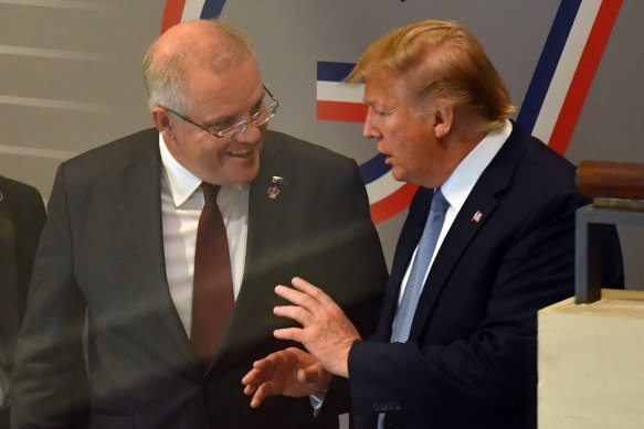 Prime Minister Scott Morrison and US President Donald Trump leave together after a meeting at the G7 summit.