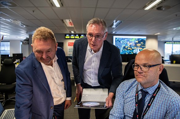 Qantas chief risk officer Andrew Monaghan (left), integrated operations centre head Ben Holland and manager Scott Fenwick.