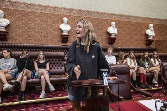 Student Satya Bollen acts out the passing of a bill in the upper house.