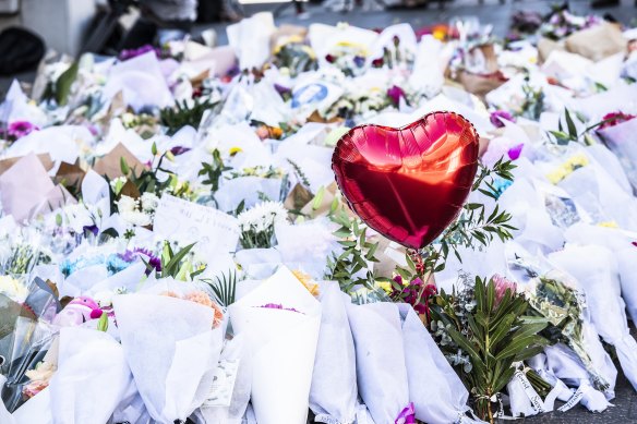 The floral tributes at Bondi Junction on Monday.