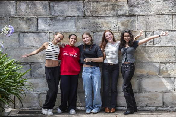 Students at St Clare’s Waverley, where tuition for year 12 is about $6800, achieved similar success rates to their high-fee counterparts. (From left) Zoe Tindale, Marianna Quintero Zuniga, Violet Henson, Sienna Gillespie and Olivia Dobbi.