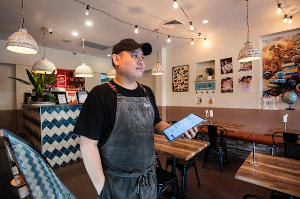 Charcoal and Crisp employee Eggy Fajardo now uses AI to help him with the weekly rosters. 