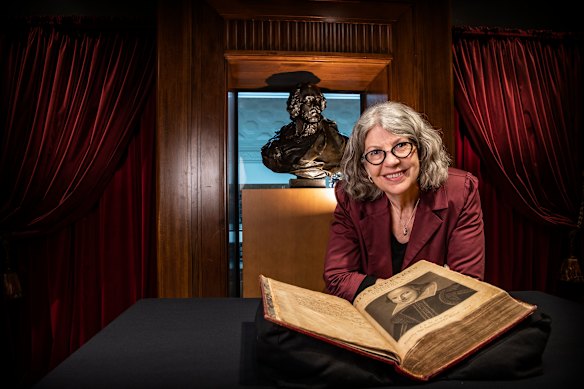 Maggie Patton, rare books specialist at the State Library of NSW, with a copy of Shakespeare's First Folio in the Shakespeare Room.