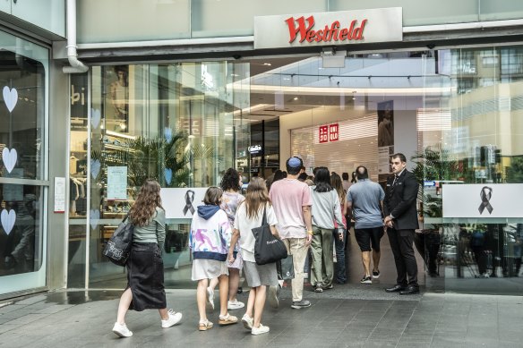 People enter Westfield Bondi Junction as the doors open for a day of reflection.