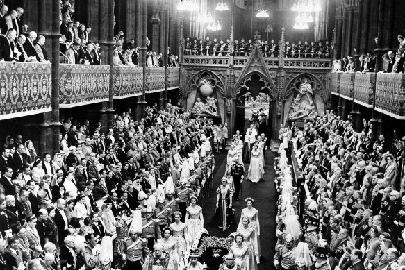 Queen Elizabeth II leads the procession through Westminster Abbey's nave after her coronation in London, England, June 2, 1953.