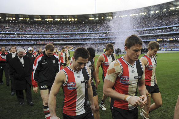 St Kilda players are dejected after the loss.