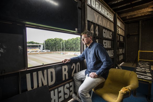 Joel Gibson the property manager at Leichhardt Oval, sits in the scoreboard box.