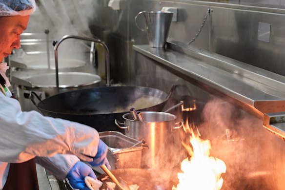 A stir-fry is prepared over high heat.
