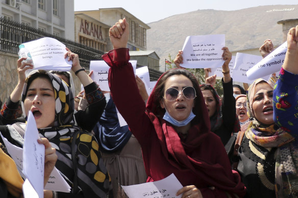 Women gather to demand their rights under the Taliban rule during a protest in Kabul on September 3.